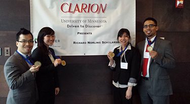 The University of Washington's 2014 CLARION National Case Competition first place winners. From left to right: Eric Sid, Nicole Kim, Huang N. Le and Juan P. Magana.