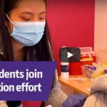 YouTube video screenshot titled "UW students join vaccination effort."
